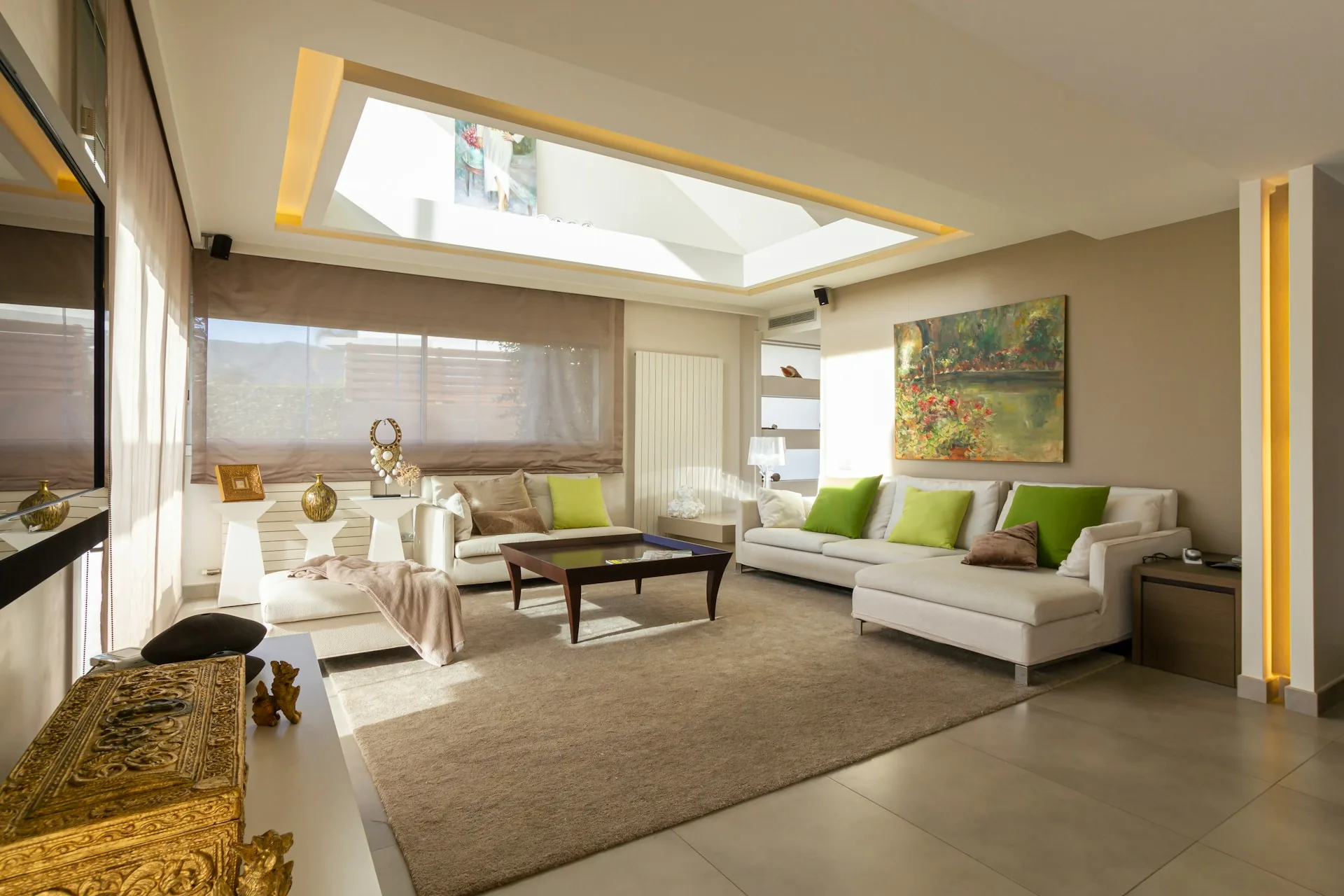 Living room under a skylight, the kind of space a sales gallery shows